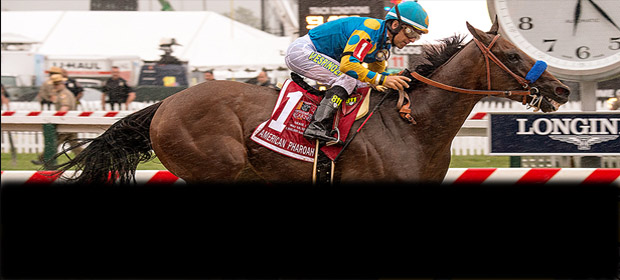 Jockey Victor Espinoza and American thoroughbred racehorse American Pharoah win the Preakness 2015.