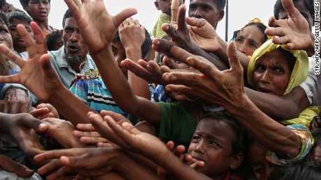 Rohingya muslims grab for aid packages flown over Bangladeshi refugee camps. 
