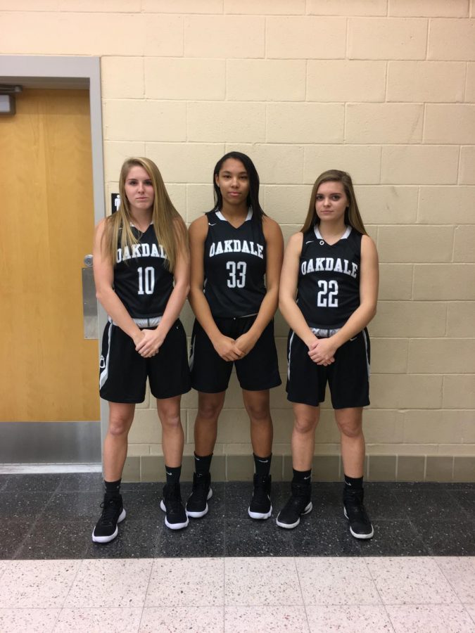 CAPTION FOR PICTURE: Sophomore Sam Foster, Junior Brianna Walker, and Senior Sarah Case pose for a picture before a practice. Be sure to come out to support the Lady Bears Basketball team this season!