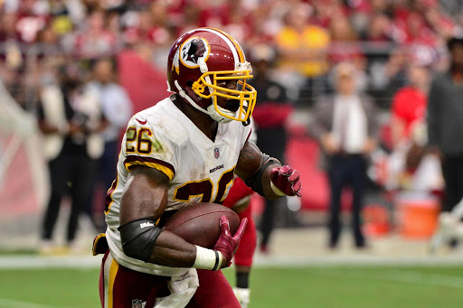 Sep 9, 2018; Glendale, AZ, USA; Washington Redskins running back Adrian Peterson (26) runs the ball during the second half against the Arizona Cardinals at State Farm Stadium. Mandatory Credit: Matt Kartozian-USA TODAY Sports