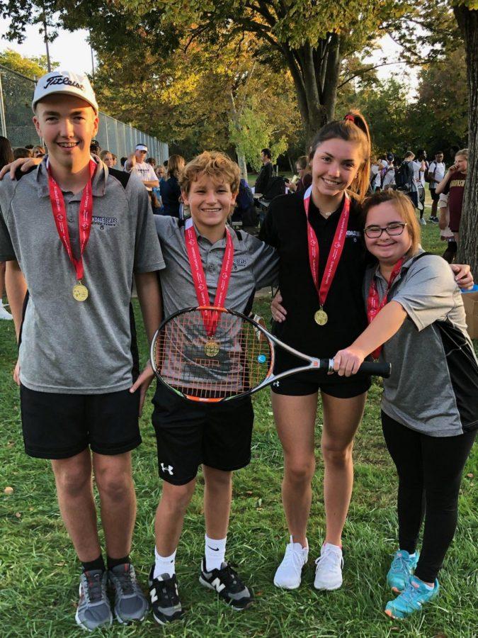 eam members, Eric Connolly, Carter Albers, Jensen Ritter, and Ellie Townsend smile after the win at District Championships

