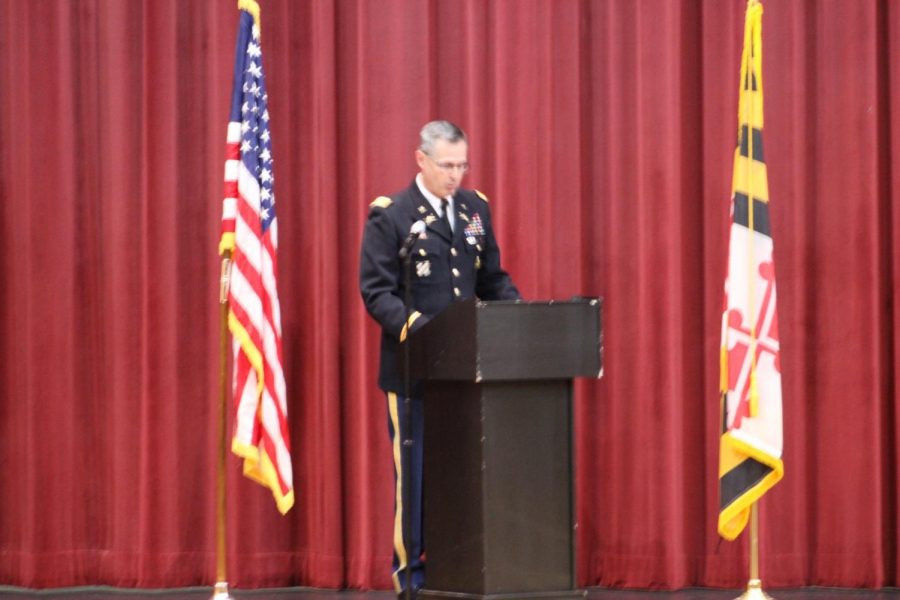 Colonel Wayne Green, Vice President and Chief of Staff at Mount Saint Mary’s University stands on the OHS auditorium stage to give speeches thanking OHS faculty staff members who served the military during Thursday’s assembly. 