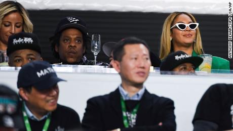 Jay-Z and Beyonce remain seated during the National Anthem at Super Bowl LIV in Miami on Sunday. 