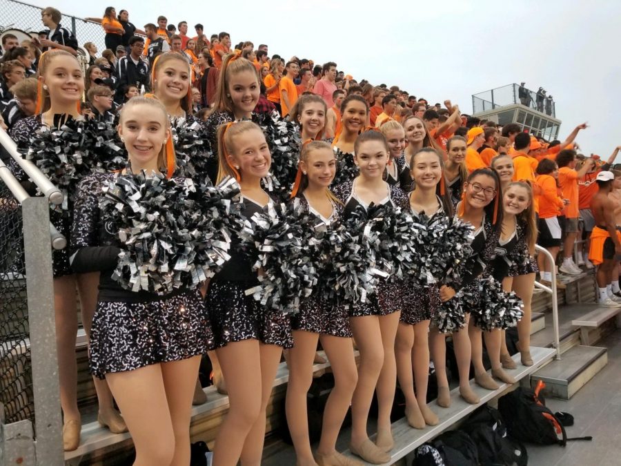 The dance team cheers on the Oakdale Bears together.
