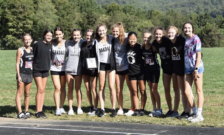 The girls cross country team poses after winning the Cougar Challenge at Catoctin High School. 
From left to right: Lynn Everly, Sydney Frownfelter, Zhana Ivanova, Madison Chorney, Caylin Walker, Sarah Anderson, Sydney Querry, Shantou Meyers, Bailey Roman, Kayla Brightman, Abby Stum, and Kylie McGlinchey

