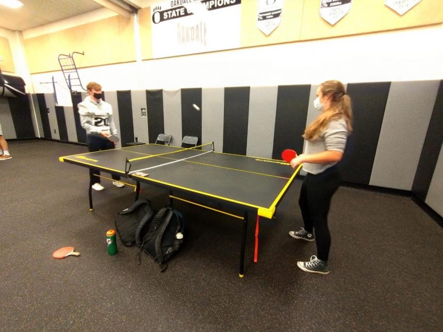 Two Oakdale High students go face-to-face in a ping pong match during the SET ping pong club meeting.