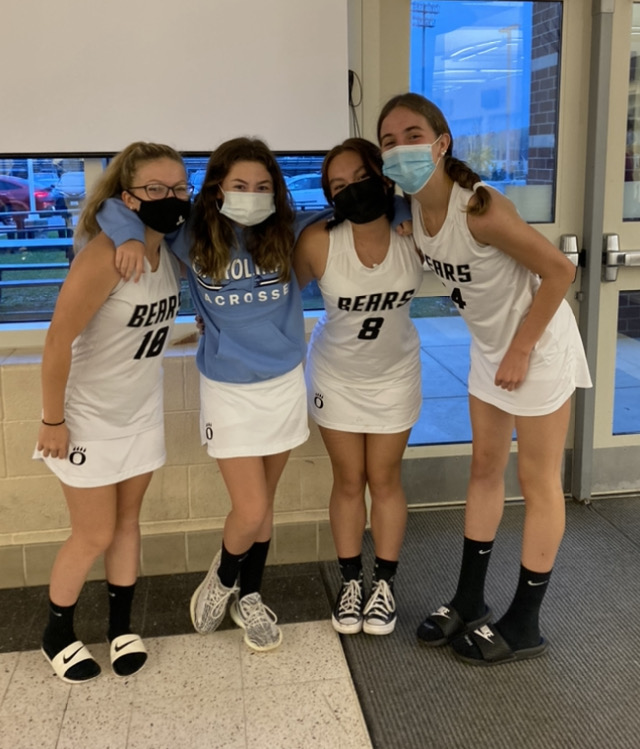 Madison Glover, Charlotte Foltyn, Marie Ireland, and Brynn Ohlhoff show their athletic side by wearing their uniforms for Athlete vs Mathlete Day: “It’s important to participate in school activities and show that you care about your school,” says Ohlhoff.
