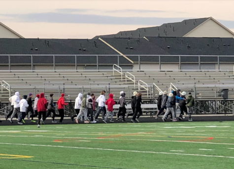  Pictured above is the team warming up before splitting into their own groups for their workouts. While the name of the sport is indoor track, due to how inconvenient it would be to actually practice on an indoor track, both the girls and boys have to practice on Oakdale’s outdoor track over the course of the season.
