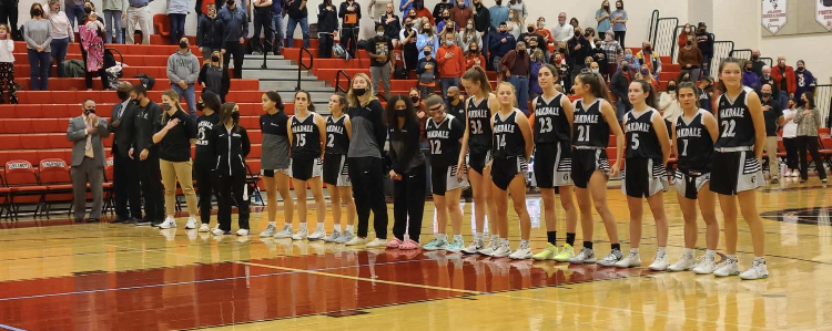 The Oakdale Girls Varsity Basketball team lines up before their game against Linganore. 
