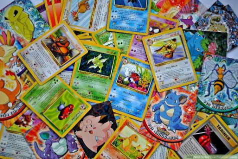 An image of many different Pokemon cards in a large pile.