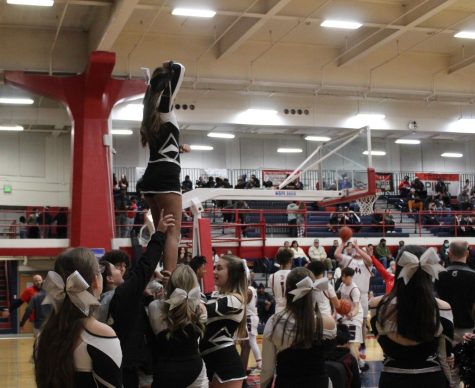 The Cheerleading Team practices and gets ready for the basketball Game at TJ High School.