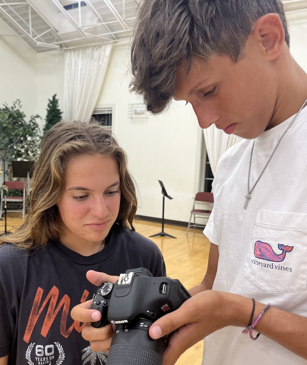 Grace Meyers (Left) and James Wilson (Right), both seniors, review a photo they’ve just taken. 