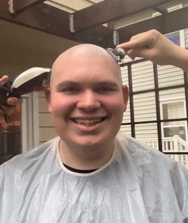 Nicholas Bonura shaves his head to support The Maryland Deaf Community.