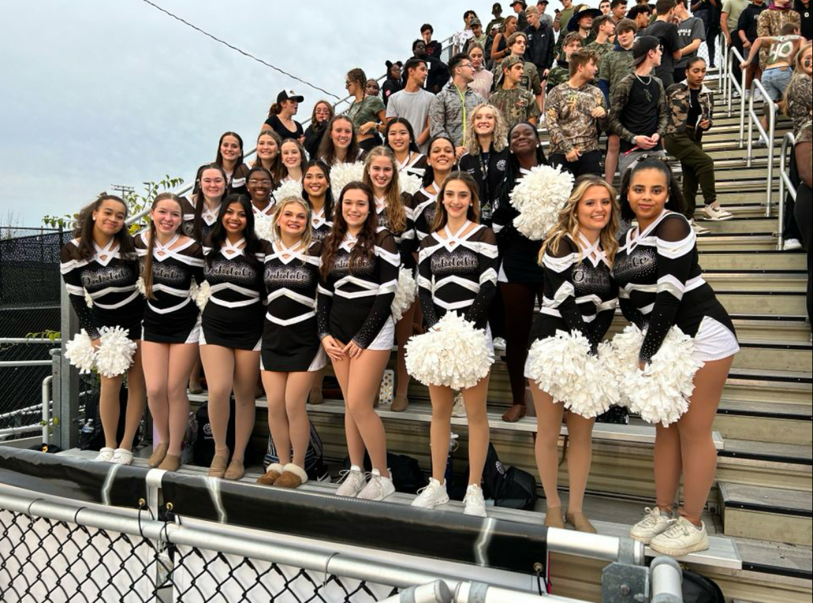 The Oakdale Poms Team getting excited for their performance at the first home game.