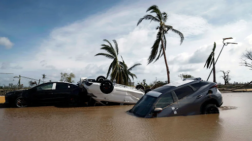 Overturned cars show only a small amount of damage the hurricane brought to Acapulco.
