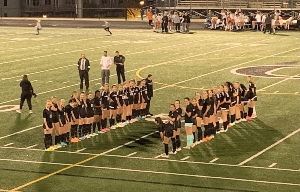 Both Varsity and Junior Varsity players lined up in the center of the field on Senior Night to present the seniors on the Varsity team.
