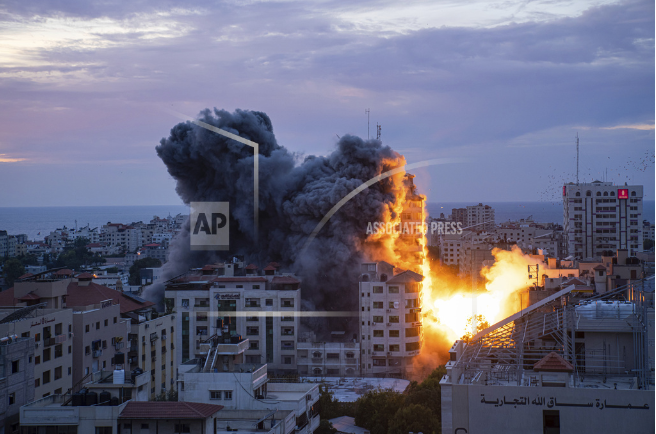 Fire and smoke rise in Gaza after an Israel airstrike.