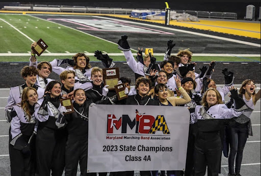 The Marching Bear Band’s seniors celebrate their victory on the track of Johnny Unitas stadium. 
