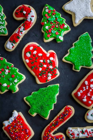 Frosted sugar Christmas cookies are very colorful with the use of seasonal decorations and details.