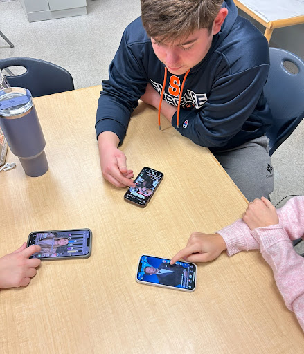 Students scroll through TikTok to catch up on all of the new trends. 
