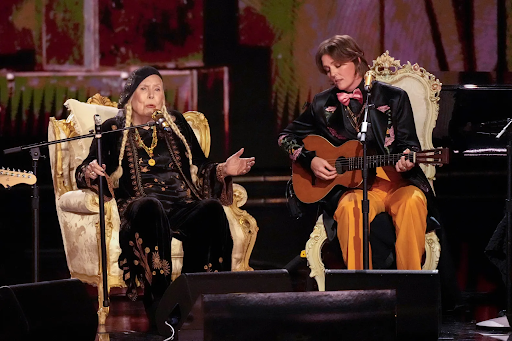 Legendary singer-songwriter Joni Mitchell took to the Grammy stage for the first time in her nearly 6-decade career, where she was introduced and accompanied by Brandi Carlile. 