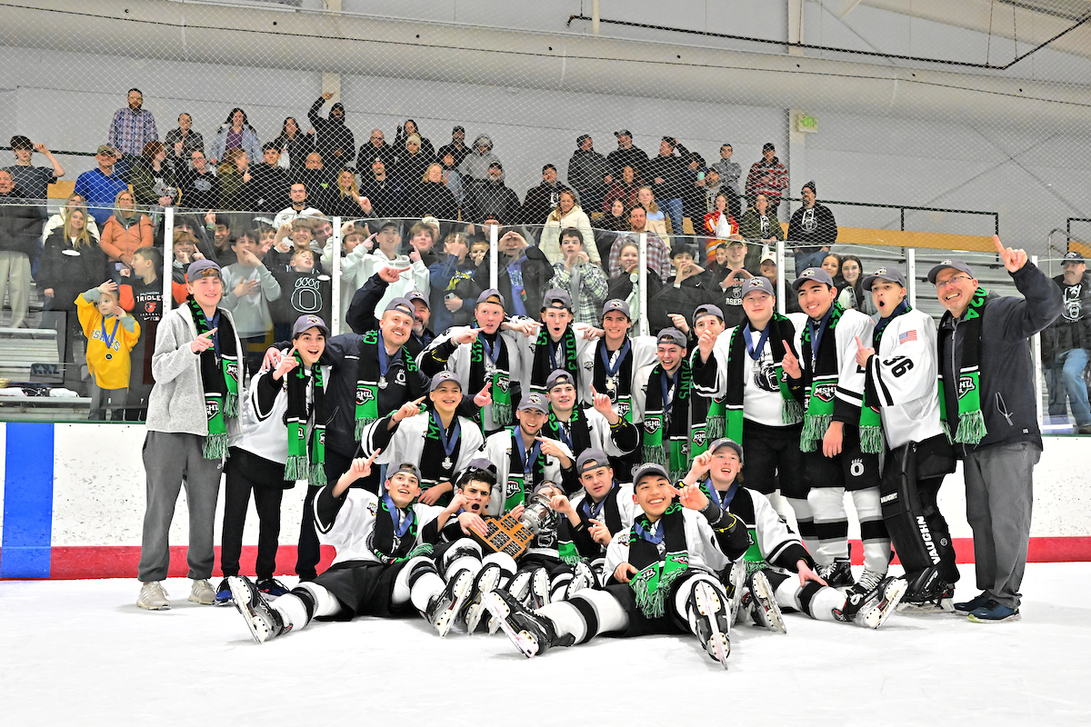 The  team poses for a photo with the crowd and with the MSHL Trophy.
“Just pure excitement, just seeing the team celebrate, the crowd going crazy. I just found my brother gave him a hug, because I know what hes been through the last couple of years playing for Oakdale. I just wanted to give him this Championship, so I just knew how much this meant to him and the entire team,” explained Timberlake.