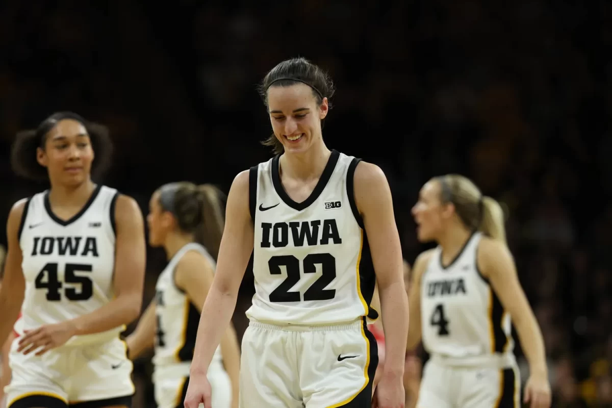 Caitlin+Clark+walks+on+the+court+with+her+teammates+during+a+game+against+Ohio+State.+