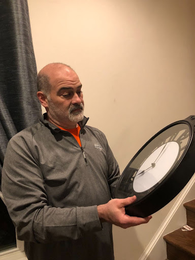 David Migdal changes the clocks in his house to be prepared for daylight savings.
