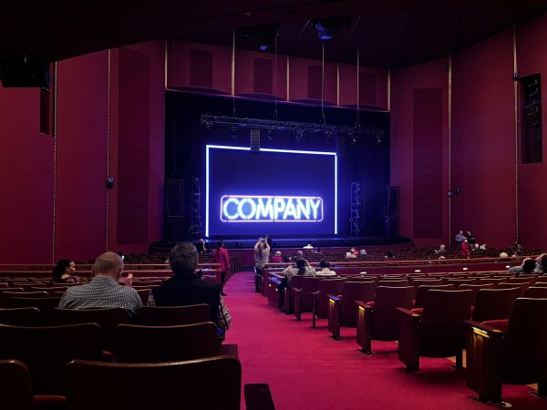 The neon sign on stage for Marianne Elliott’s production of Company was lighted before the show began at the Kennedy Center.
