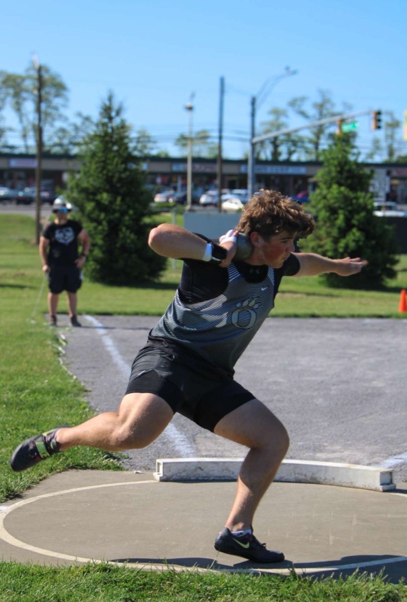 Junior and throws captain Grant Lohr throwing at the CMC meet