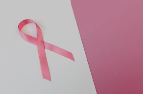 A photo of a pink ribbon, which represents the symbol for breast cancer awareness and breast cancer.